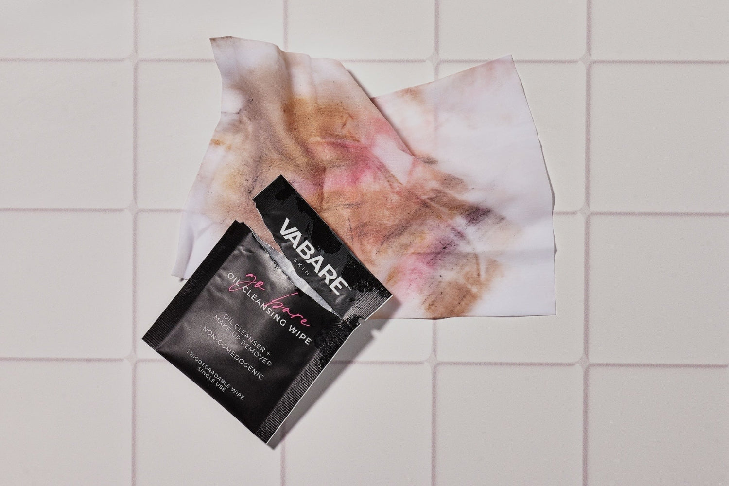 VABARE oil cleansing makeup wipe packaging on a tiled surface